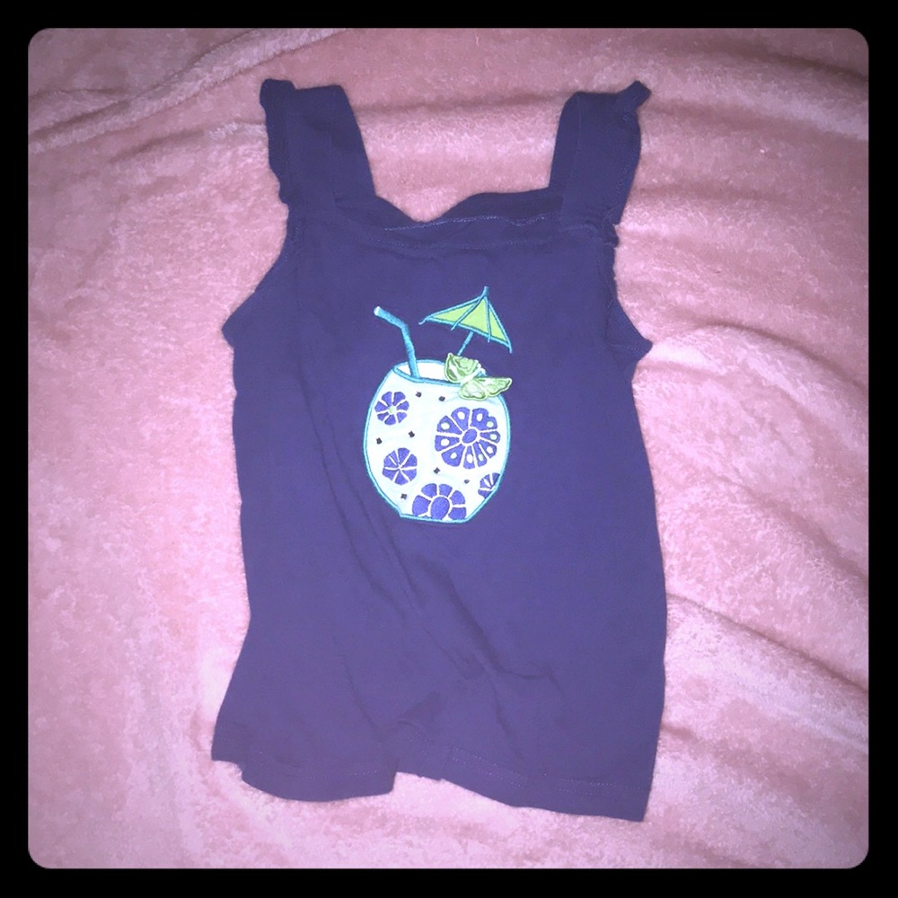 A navy blue shirt for kids with decoration.